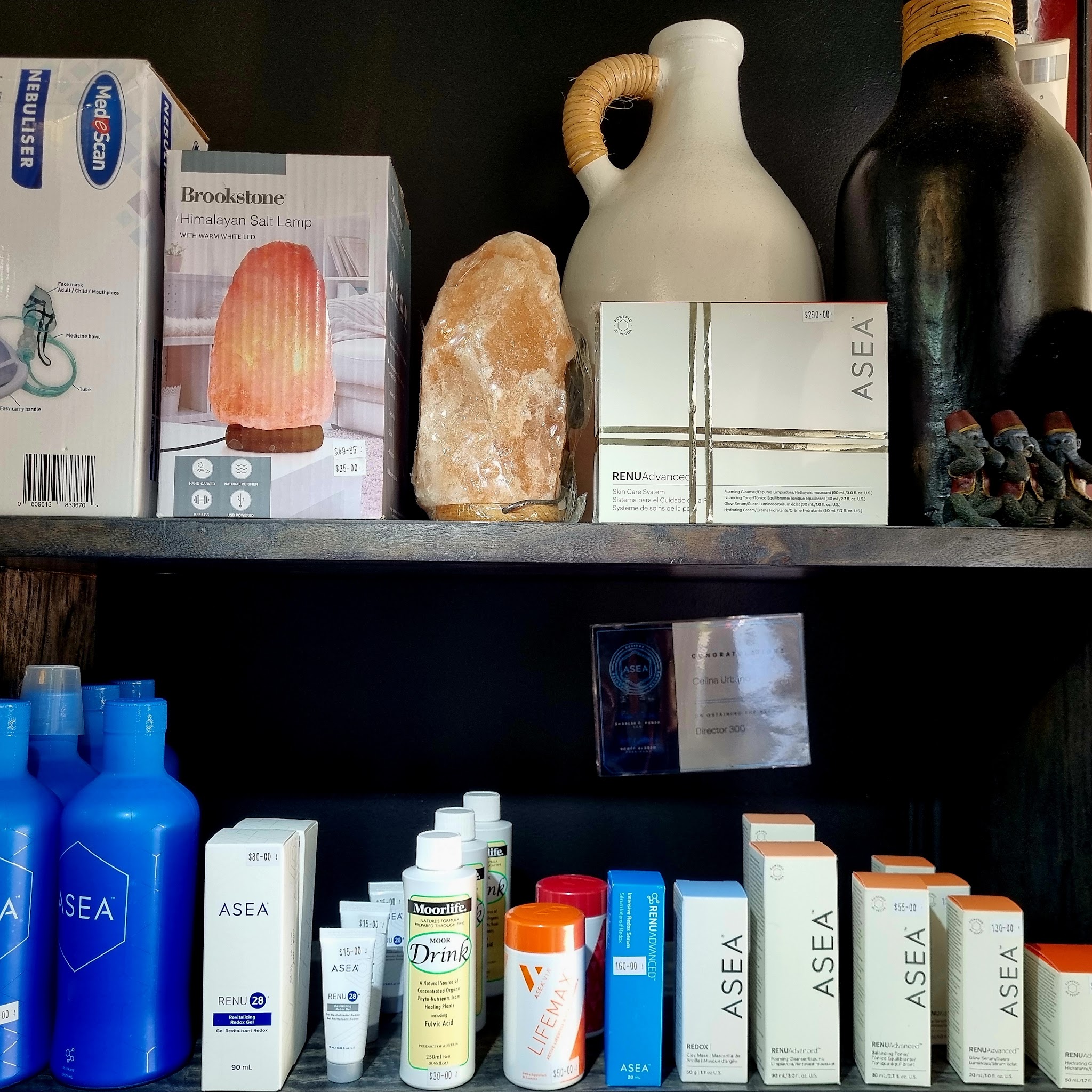 Shelves of skincare and wellness products with a Himalayan salt lamp