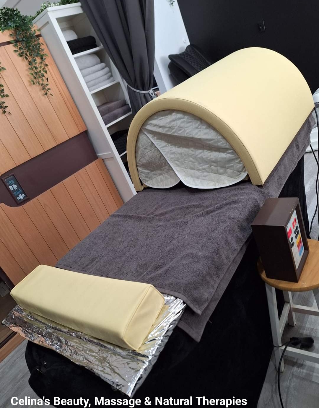 The infrared heat treatment bed set up with towels in the studio